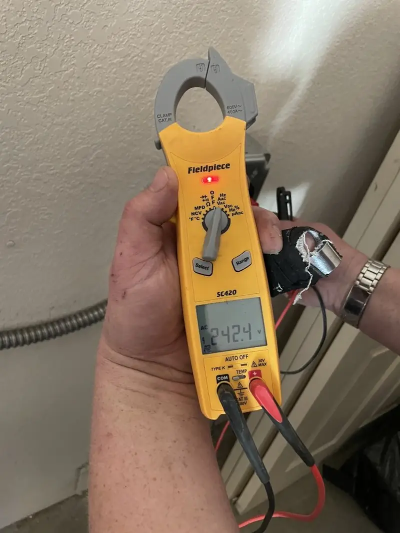 Voltage testing with clamp meter during Outlet Installation in Glendale